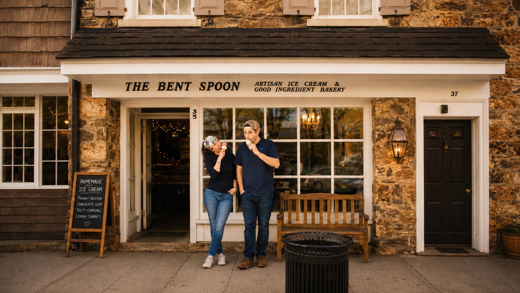 Gab and Matt eating ice cream cones outside The Bent Spoon storefront